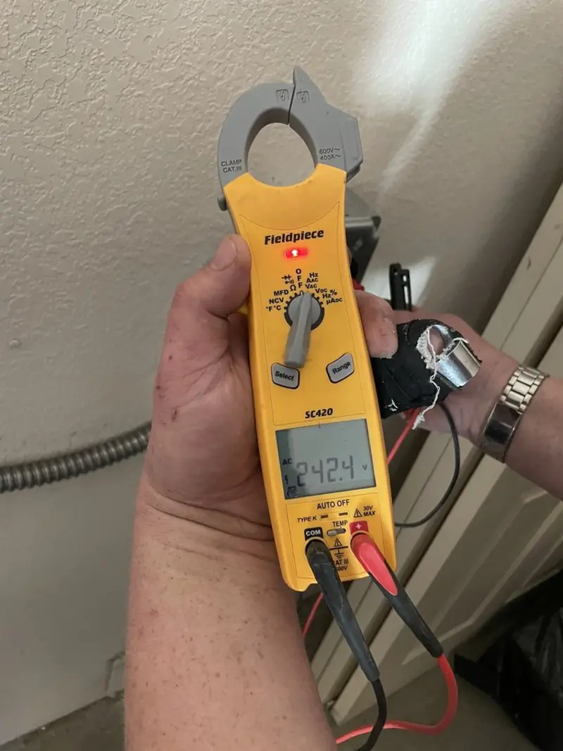 Voltage testing with clamp meter during Generator Installation in Wall